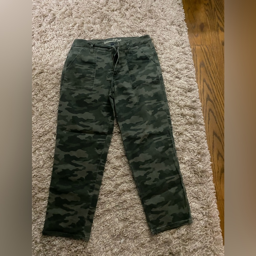 Excellent straight leg camouflage jeans. Cargo pockets in back with gold snap.